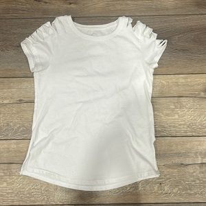 White tee slits on sleeves and on sides where made at home